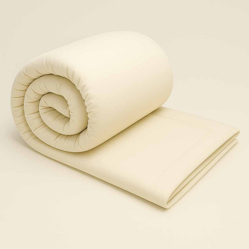 Rolled natural wool duvet insert on neutral background
