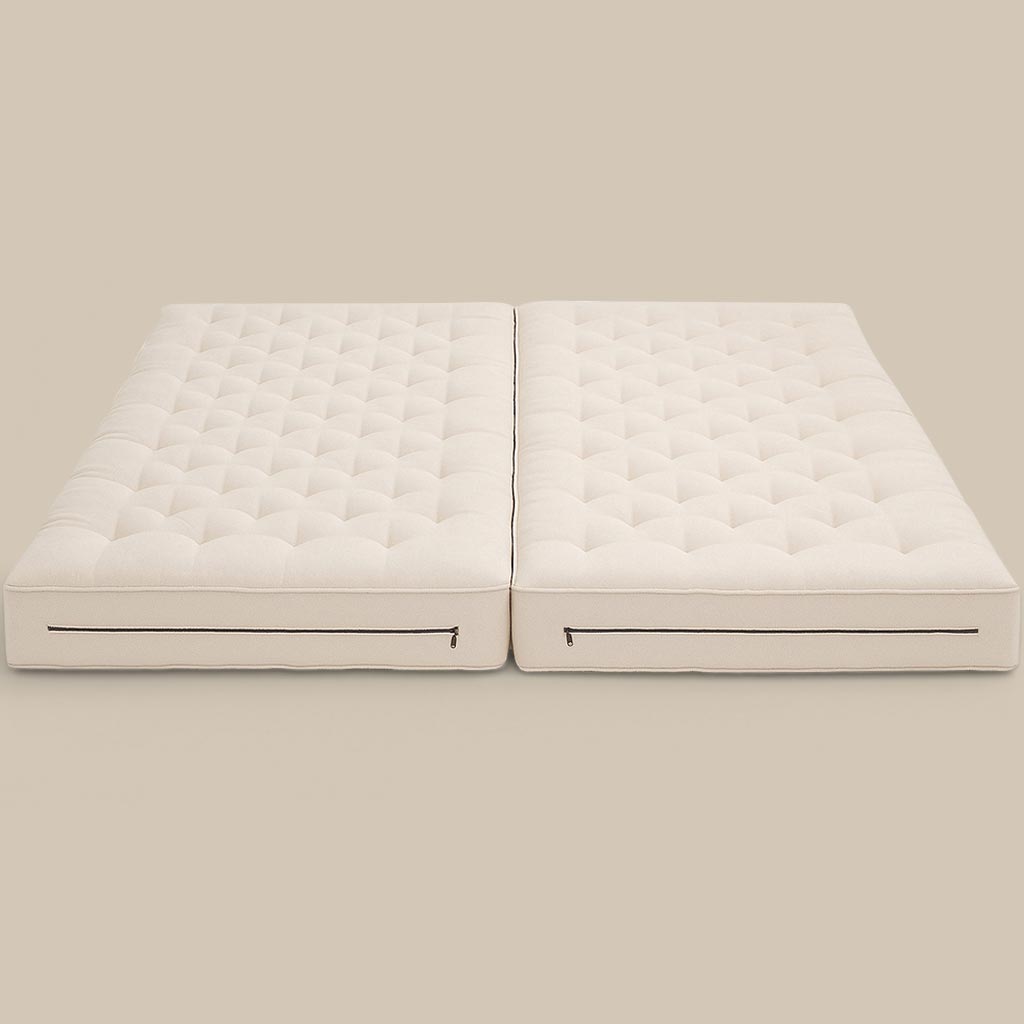 Split wool mattress with certified filling and hand-tufted surface, featuring a center zipper for easy separation or connection