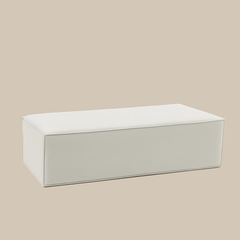 Foldable wool mattress in light grey linen cover on beige background