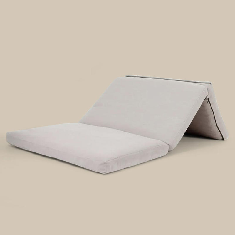 Foldable wool mattress with certified wool filling and natural linen cover, shown partially folded on neutral background
