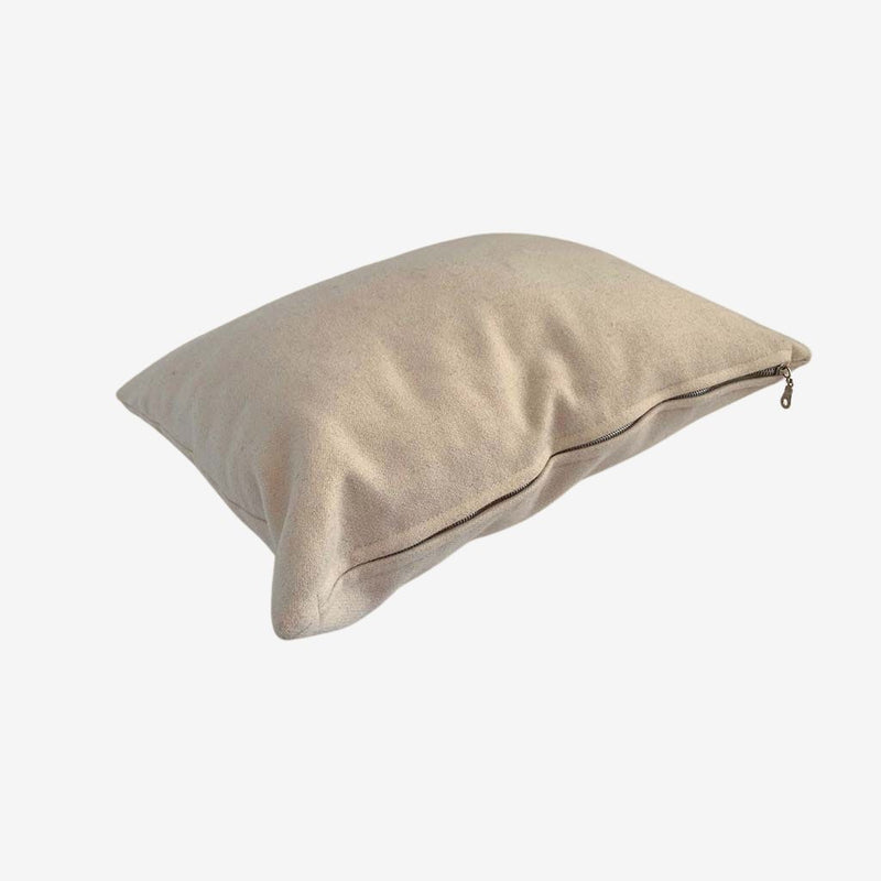 Natural wool pillow with soft wool fabric cover and zippered closure, offering breathable, adjustable comfort.
