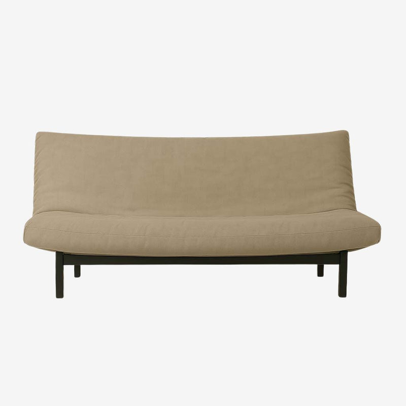 Natural wool futon mattress with certified filling, shown on a minimalist black frame in a sitting position.